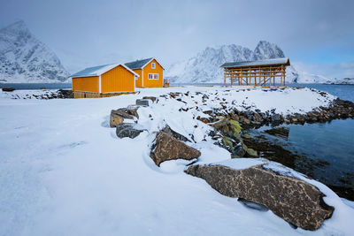 House on snow covered landscape