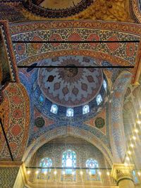 Low angle view of illuminated ceiling