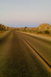 Road against clear sky