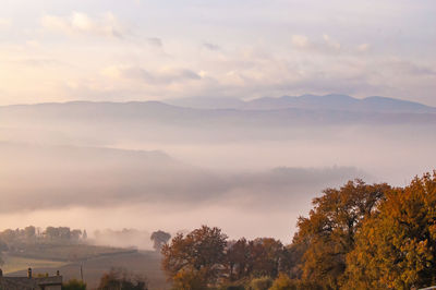 Scenic view of mountains against sky during sunset