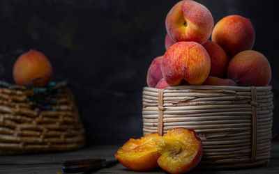 Close-up of apples in basket on table