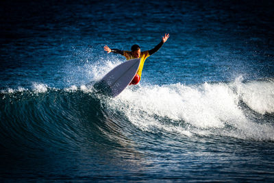 Man surfing in sea