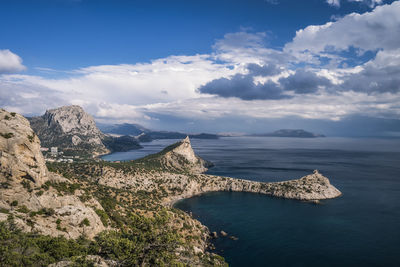 Mount falcon lit by pink sunset in novyi svit. sudak, the republic of crimea. aerial view