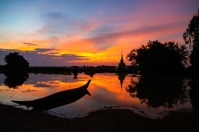 Scenic view of lake against sky during sunset