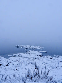 Scenic view of frozen sea against clear sky