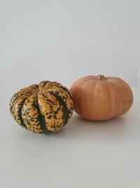 Close-up of pumpkins against white background