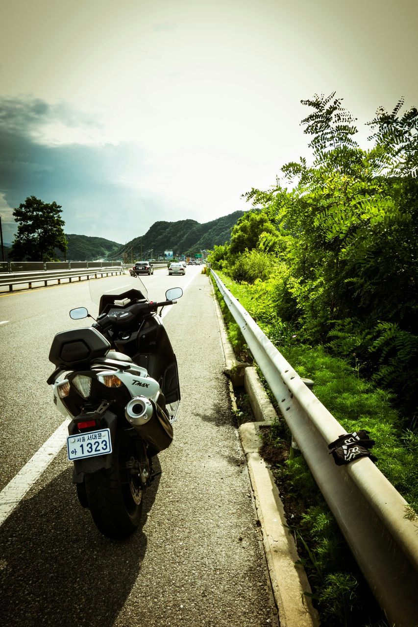 transportation, mode of transport, land vehicle, tree, men, lifestyles, leisure activity, road, riding, sky, car, bicycle, person, travel, motorcycle, street, on the move, the way forward, high angle view