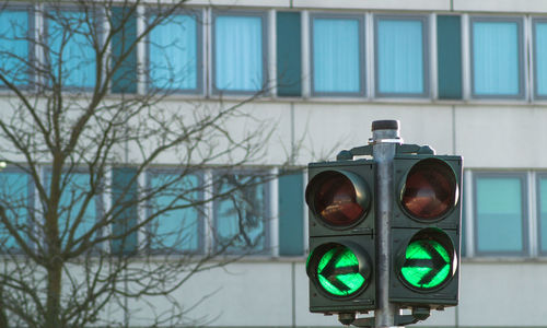 Close-up of stoplight against building