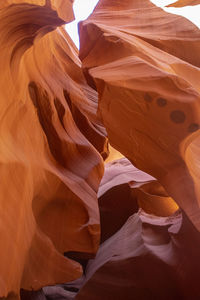 Low section of man standing on rock formations