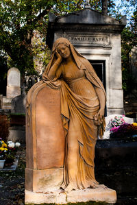 Statue of buddha in cemetery