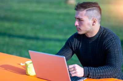 Young man using laptop