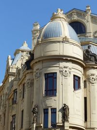 Low angle view of building against blue sky