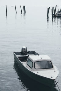 Boat moored in lake