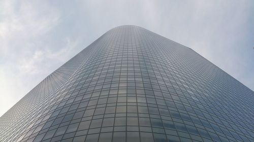 Low angle view of tall building against sky