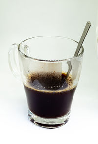 Close-up of coffee cup against white background