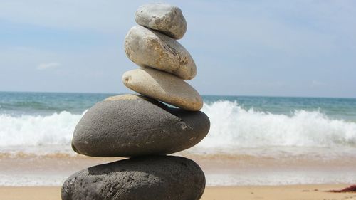 Stacking stones on beach