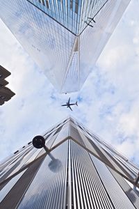 Low angle view of building against cloudy sky