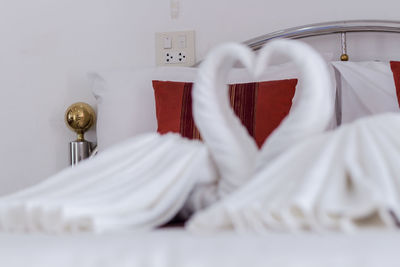 Swan shape sheets on beds at home