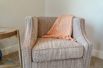 Close-up of sofa against wall at home