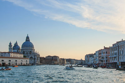 View of canal and cathedral against sky