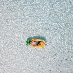 High angle view of man swimming in pool