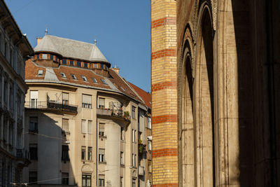 Low angle view of buildings against clear sky