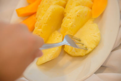 Close-up of hand holding ice cream