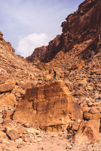 Rock formation on mountain against sky