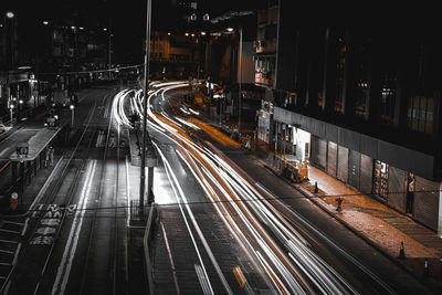 High angle view of light trails on road at night