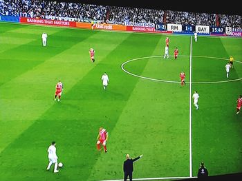 High angle view of people playing soccer on field