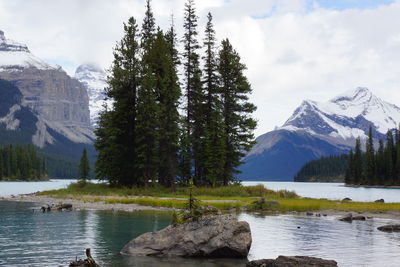 Scenic view of river with mountains in background