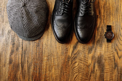 High angle view of shoes on hardwood floor