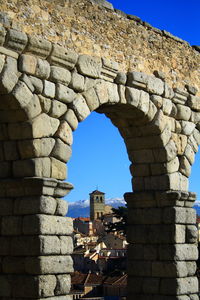 Low angle view of historical building against blue sky