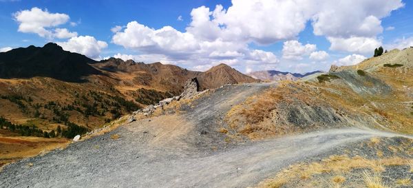 Panoramic view of landscape against cloudy sky