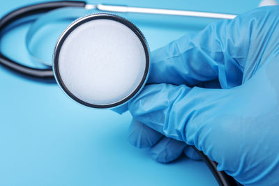 Close-up of human hand holding eyeglasses