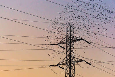 Low angle view of electricity pylon