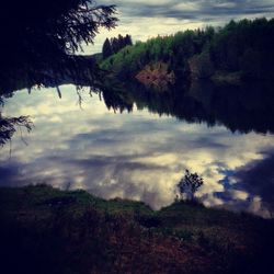 Scenic view of landscape against cloudy sky