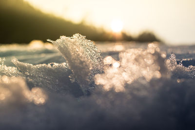 Close-up of frozen sea against sky