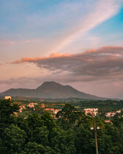 Scenic view of mountains against sky at sunset