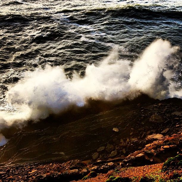 water, surf, motion, wave, power in nature, sea, splashing, beauty in nature, nature, scenics, rock - object, flowing water, high angle view, long exposure, waterfall, rock formation, outdoors, breaking, day, flowing