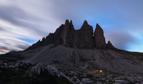 Low angle view of rock formations against sky