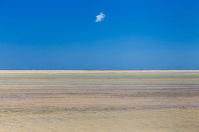 View of landscape against clear blue sky