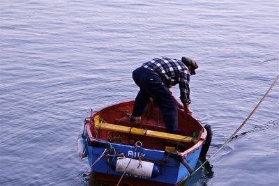 Rear view of a man in boat