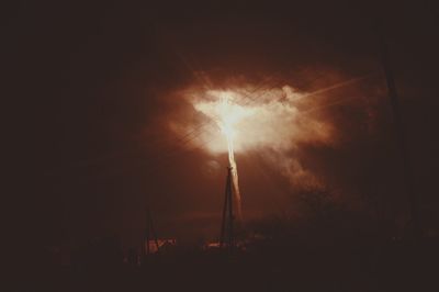 Low angle view of illuminated building against sky