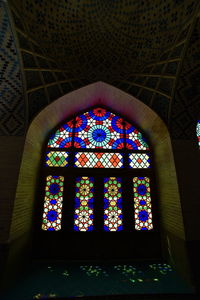 Low angle view of glass window in temple