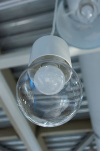 High angle view of light bulb hanging from ceiling 