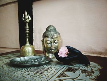 Close-up of statue on table