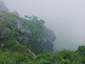 Scenic view of mountains in foggy weather