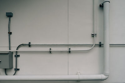 Pipes on white wall