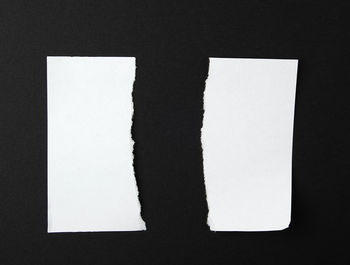 High angle view of paper against black background